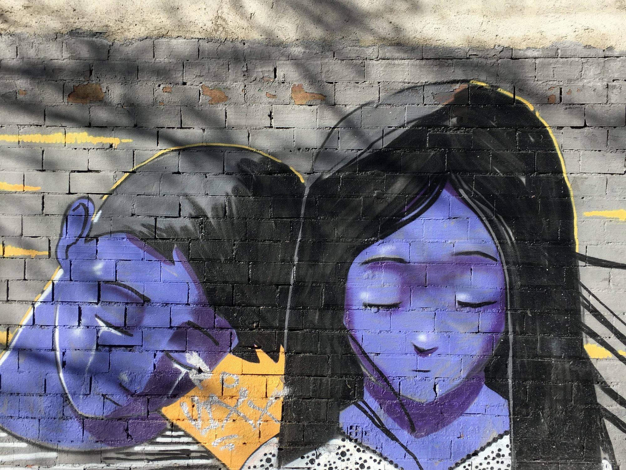 Graffitti of Girl and Boy in Madrid, near Atocha Station